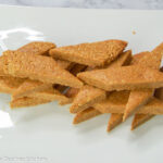 peanut brittle displayed on a white plate