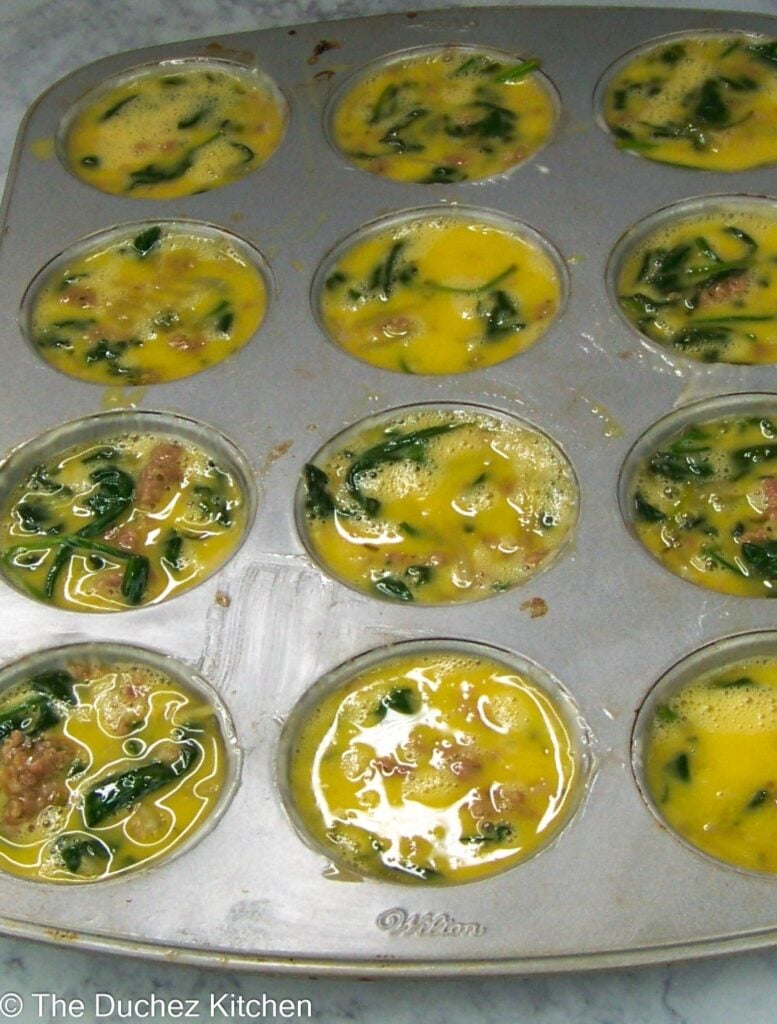 egg muffins in a muffins pans to be baked